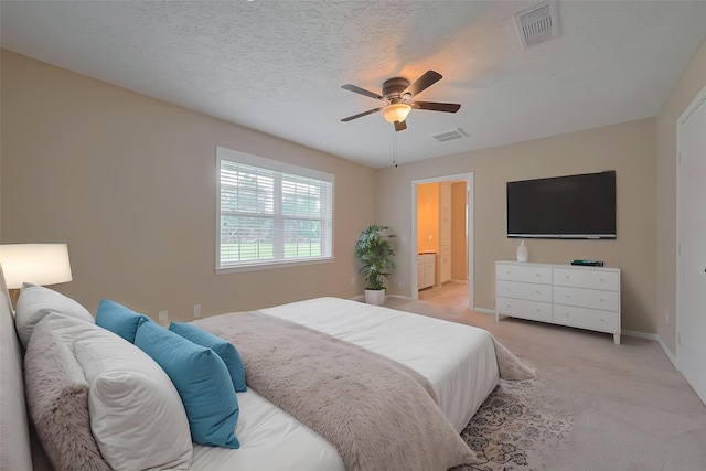 bedroom featuring light carpet, baseboards, visible vents, and ceiling fan