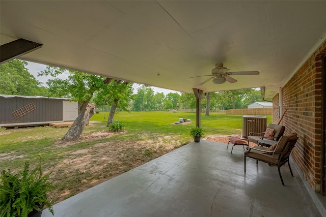 view of patio / terrace with fence, cooling unit, and ceiling fan