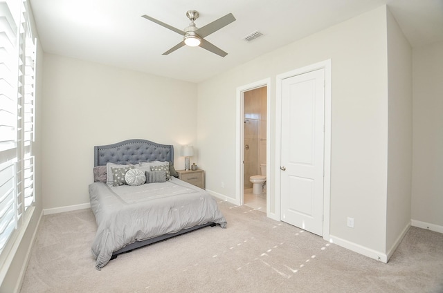 1310 Layla Sage Loop, Richmond, TX 77406 - carpeted bedroom featuring visible vents, ensuite bath, and multiple windows