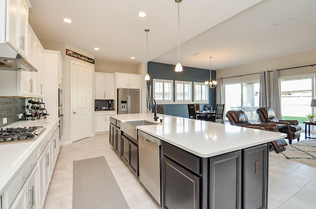 1310 Layla Sage Loop, Richmond, TX 77406 - kitchen featuring appliances with stainless steel finishes, decorative backsplash, white cabinets, and a sink