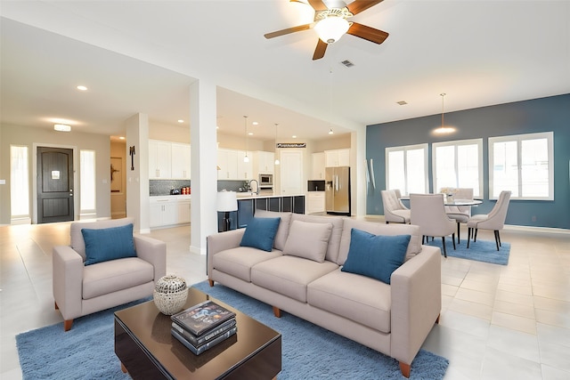 1310 Layla Sage Loop, Richmond, TX 77406 - living area with light tile patterned floors, recessed lighting, ceiling fan, and visible vents