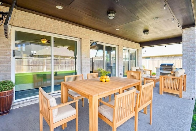 1310 Layla Sage Loop, Richmond, TX 77406 - sunroom / solarium with outdoor dining space, track lighting, and exterior kitchen
