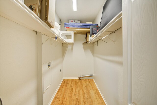 walk in closet featuring light wood-style floors