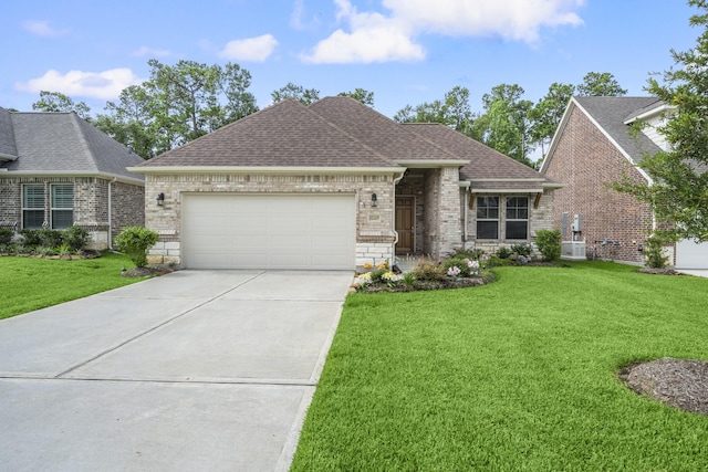 12117 Creekside Villas Ct, Conroe, TX 77304 - view of front of property featuring roof with shingles, brick siding, concrete driveway, a garage, and a front yard