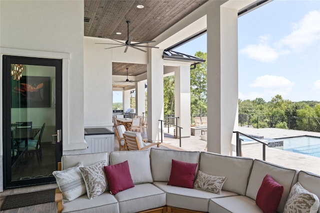 view of patio / terrace with a ceiling fan, outdoor lounge area, and an outdoor pool