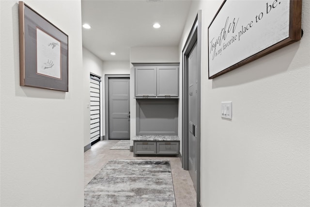 corridor featuring recessed lighting and light tile patterned flooring