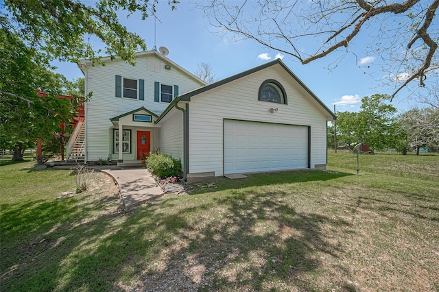 view of front of property with stairs, an attached garage, and a front lawn