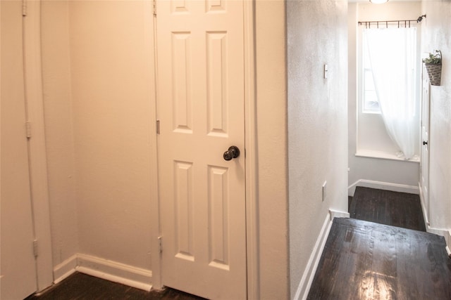 2817 Southmore Blvd, Houston, TX 77004 - corridor featuring dark wood-type flooring, a textured wall, and baseboards