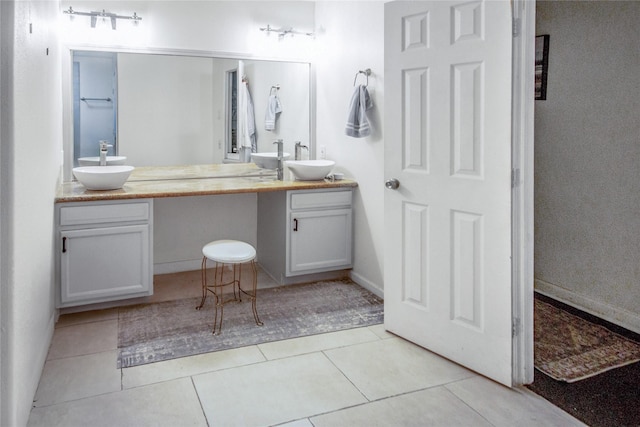 2817 Southmore Blvd, Houston, TX 77004 - bathroom featuring double vanity, a sink, and tile patterned floors