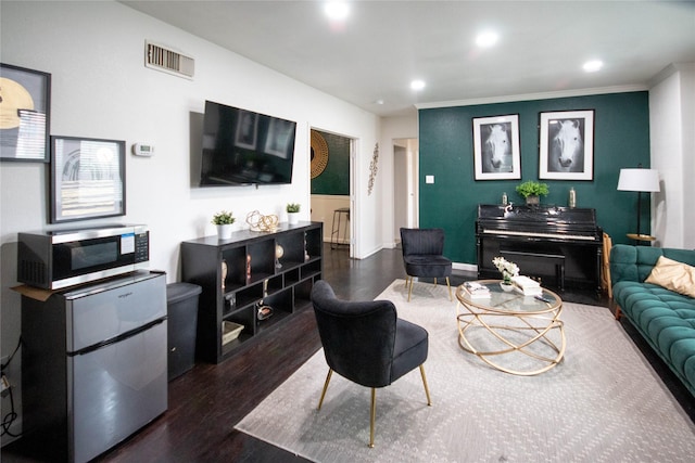 2817 Southmore Blvd, Houston, TX 77004 - living room featuring recessed lighting, wood finished floors, baseboards, visible vents, and crown molding