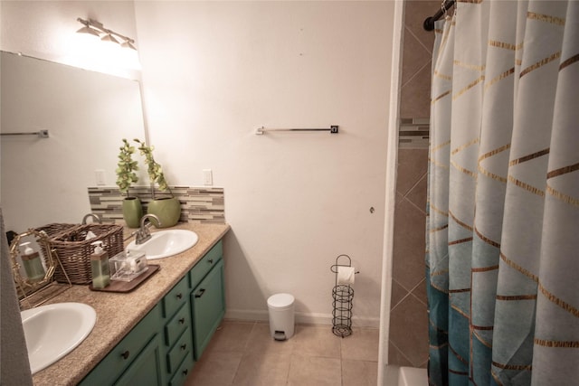 2817 Southmore Blvd, Houston, TX 77004 - bathroom with double vanity, decorative backsplash, tile patterned flooring, and a sink