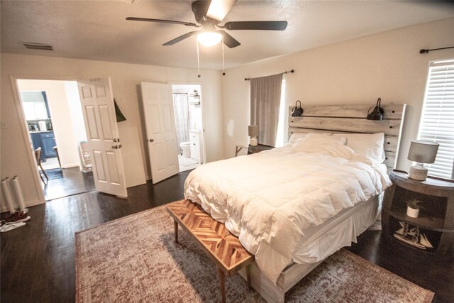 2817 Southmore Blvd, Houston, TX 77004 - bedroom featuring visible vents, ceiling fan, ensuite bath, and dark wood finished floors