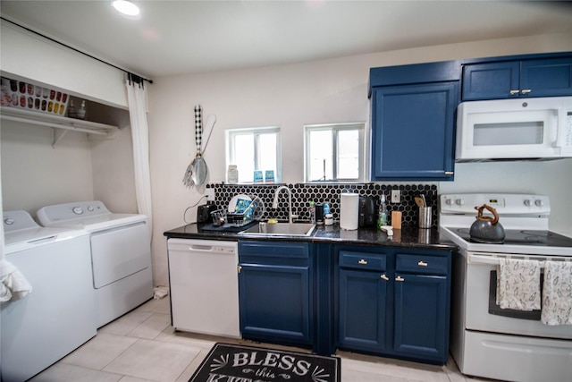 2817 Southmore Blvd, Houston, TX 77004 - kitchen with washer and dryer, white appliances, blue cabinetry, and a sink