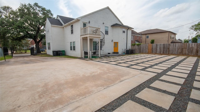 2817 Southmore Blvd, Houston, TX 77004 - rear view of house with cooling unit, stairs, driveway, and fence