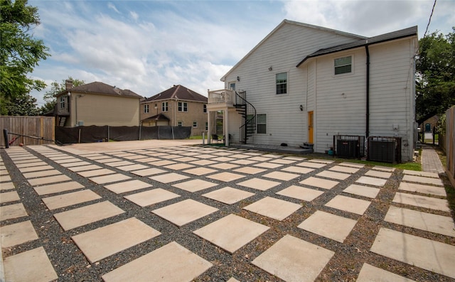 2817 Southmore Blvd, Houston, TX 77004 - rear view of property with fence, stairway, central air condition unit, and a residential view