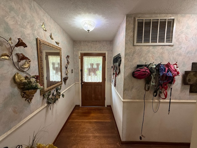 9341 Rosstown Way, Houston, TX 77080 - entryway with wood finished floors, a textured ceiling, and wallpapered walls