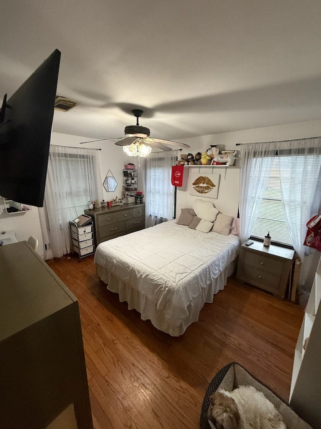 9341 Rosstown Way, Houston, TX 77080 - bedroom featuring wood finished floors and a ceiling fan