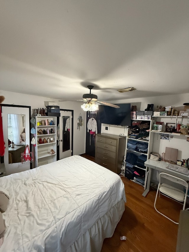 9341 Rosstown Way, Houston, TX 77080 - bedroom featuring wood finished floors and ceiling fan