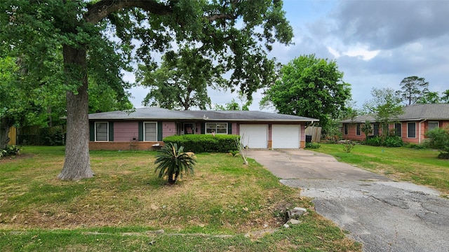 9341 Rosstown Way, Houston, TX 77080 - ranch-style house with a garage, concrete driveway, a front lawn, and brick siding