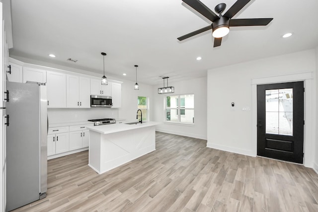 701 E Canino Rd, Houston, TX 77037 - kitchen with light countertops, recessed lighting, ceiling fan, and appliances with stainless steel finishes
