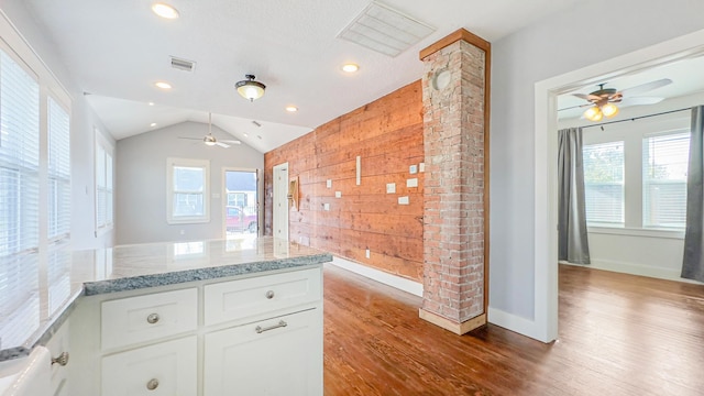 kitchen with wood finished floors, ceiling fan, and a healthy amount of sunlight