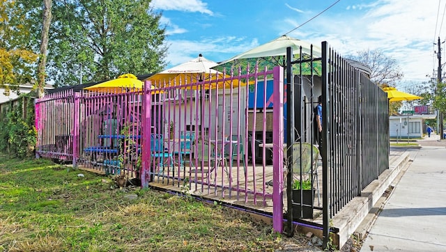 view of gate with fence