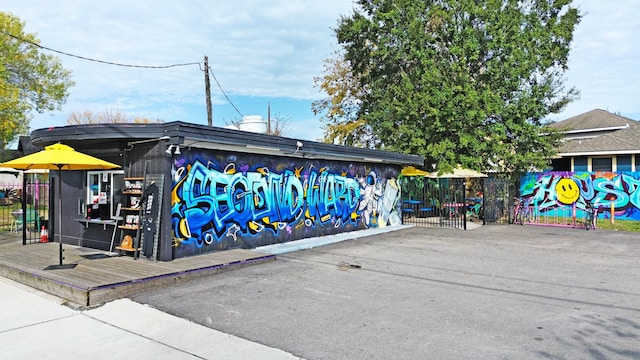 view of community featuring fence