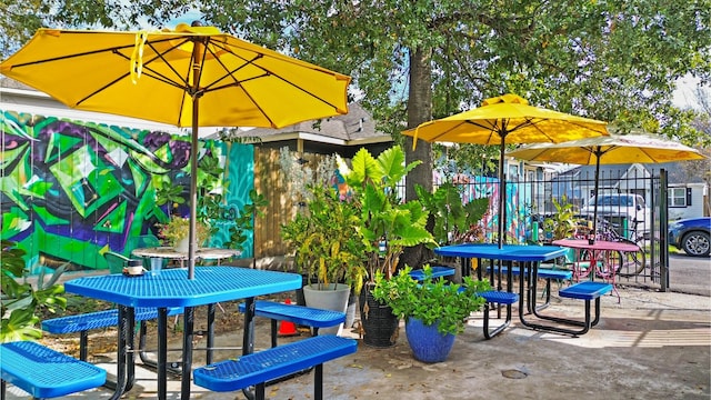 exterior space with fence and outdoor dining space