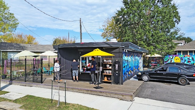 exterior space with fence and an outdoor structure