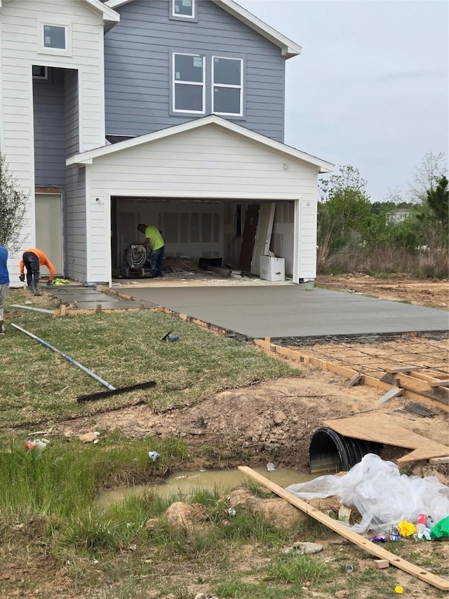 6149 Rd 5503, Cleveland, TX 77327 - view of property exterior featuring a garage and concrete driveway