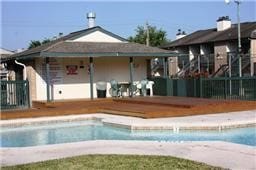 community pool featuring fence