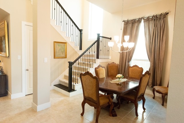 11903 Muir Groves Trl, Humble, TX 77346 - dining space with stairway, baseboards, a healthy amount of sunlight, and a notable chandelier