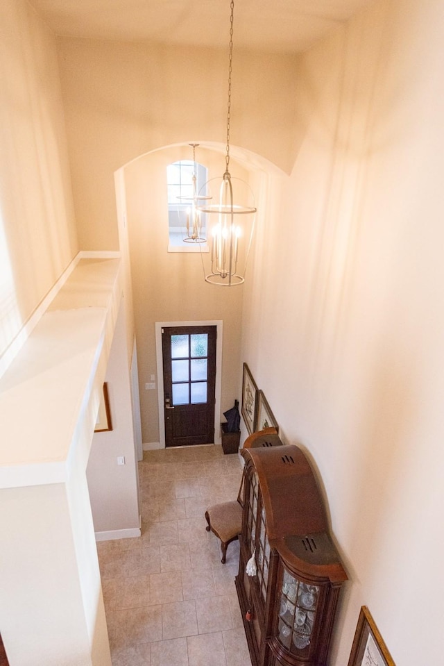 11903 Muir Groves Trl, Humble, TX 77346 - entrance foyer featuring a high ceiling, arched walkways, and a notable chandelier