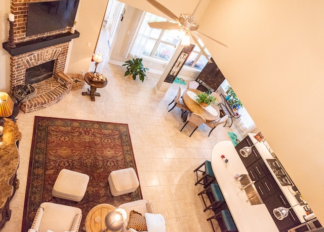 11903 Muir Groves Trl, Humble, TX 77346 - tiled living area featuring a fireplace and a ceiling fan