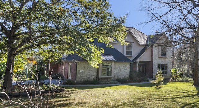 20105 Hilltop Ranch Dr, Montgomery, TX 77316 - rear view of property featuring a lawn, a standing seam roof, and stone siding