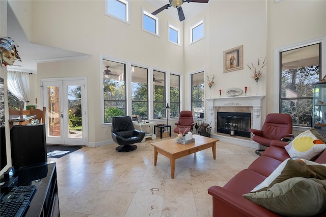 20105 Hilltop Ranch Dr, Montgomery, TX 77316 - living room featuring ornamental molding, ceiling fan, a high ceiling, french doors, and a premium fireplace