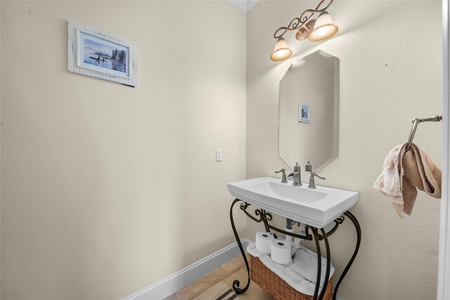 20105 Hilltop Ranch Dr, Montgomery, TX 77316 - bathroom featuring baseboards, a sink, and tile patterned flooring