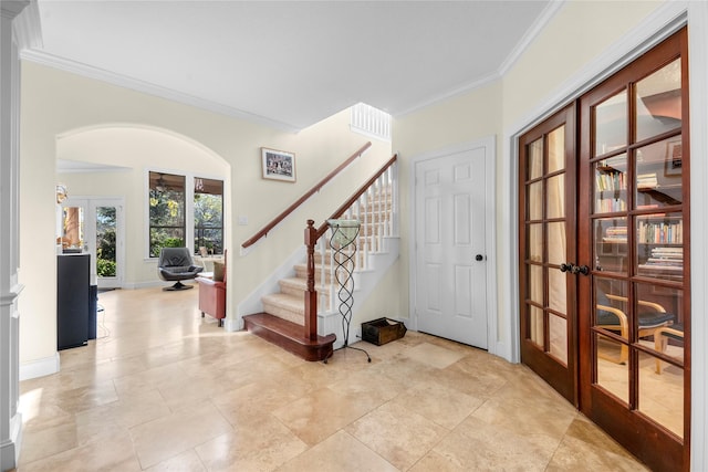 20105 Hilltop Ranch Dr, Montgomery, TX 77316 - foyer featuring crown molding, arched walkways, french doors, baseboards, and stairway