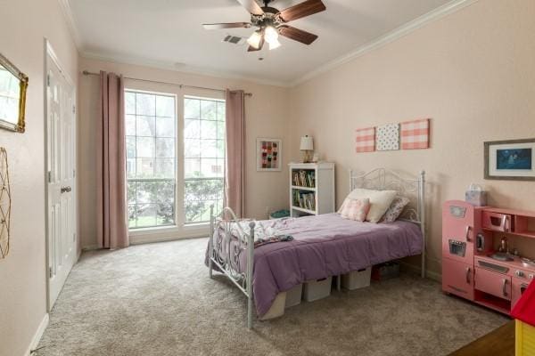 bedroom with carpet flooring, crown molding, and visible vents