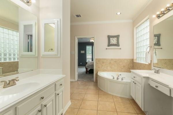full bathroom featuring tile patterned floors, visible vents, a sink, and crown molding