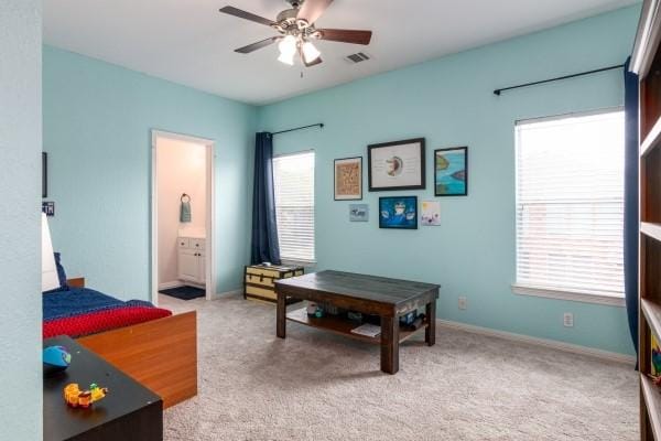 bedroom with carpet floors, multiple windows, and visible vents