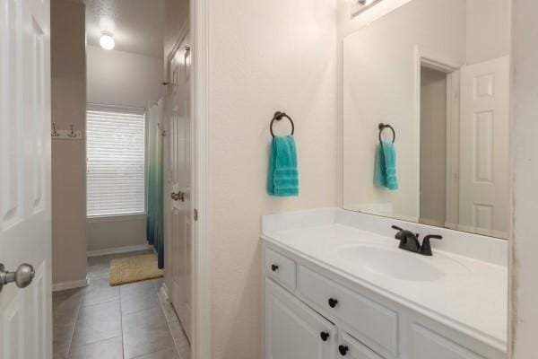 bathroom featuring tile patterned floors and vanity