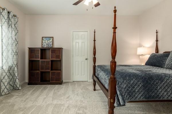 carpeted bedroom featuring a ceiling fan