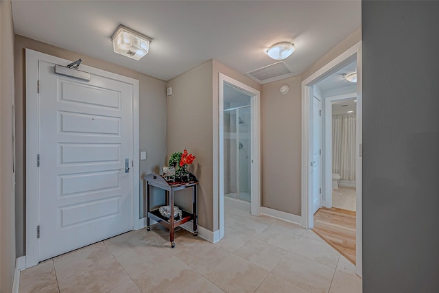 801 E Beach Dr Unit Tw1012, Galveston, TX 77550 - entrance foyer featuring light tile patterned floors and baseboards