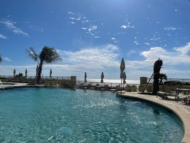 801 E Beach Dr Unit Tw1012, Galveston, TX 77550 - community pool featuring a patio
