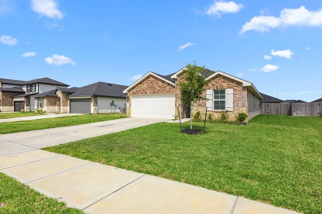 view of front facade featuring fence, concrete driveway, brick siding, a front yard, and a garage