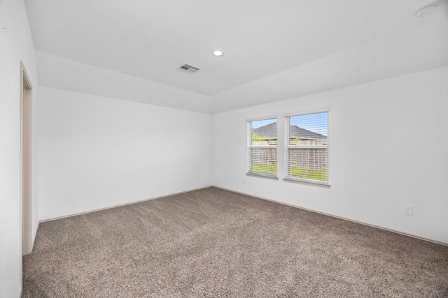 spare room featuring carpet flooring, visible vents, and recessed lighting