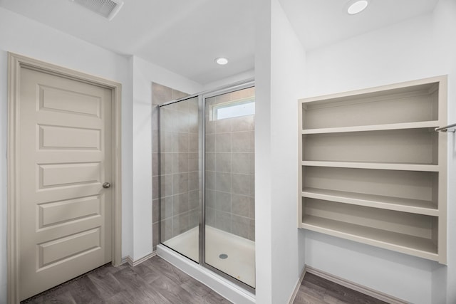 full bath featuring recessed lighting, wood finished floors, visible vents, and a stall shower