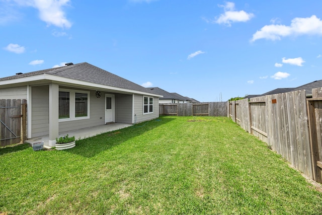 view of yard with a fenced backyard and a patio