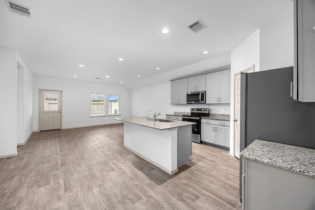 kitchen with recessed lighting, light wood finished floors, visible vents, and appliances with stainless steel finishes